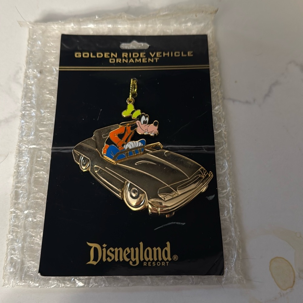 Disneyland Golden Ride Vehicle Ornament featuring Goofy driving an Autopia car.
